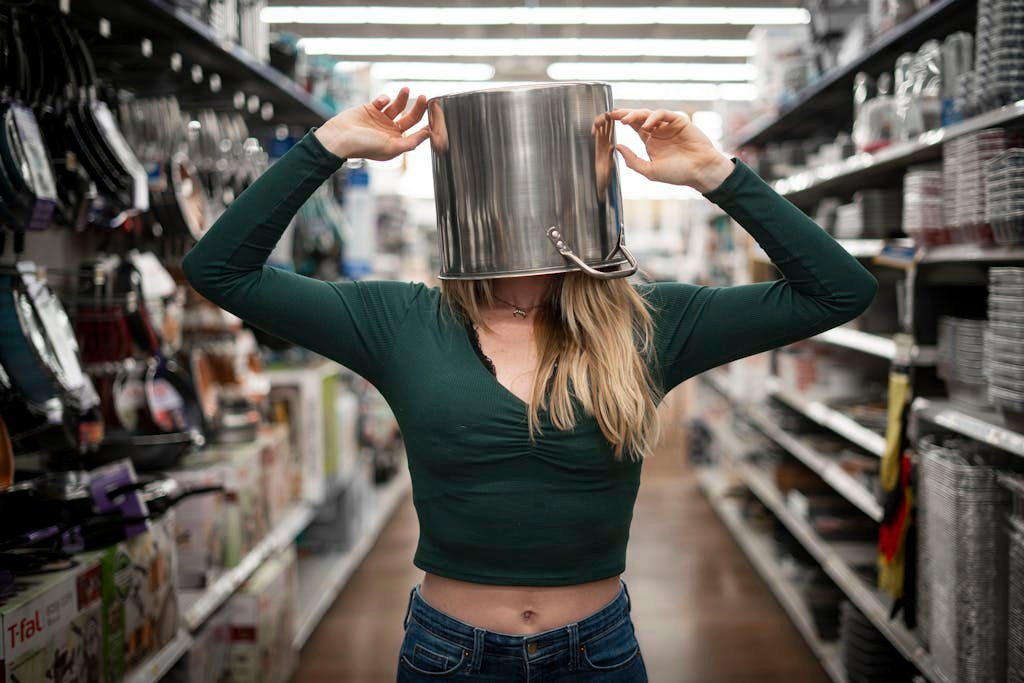 Woman with Casserole on Head Standing on the Aisle